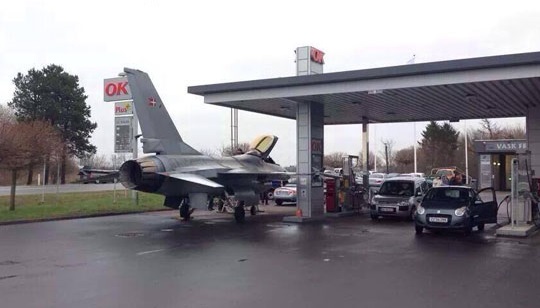 funny-picture-plane-charging-gas-station